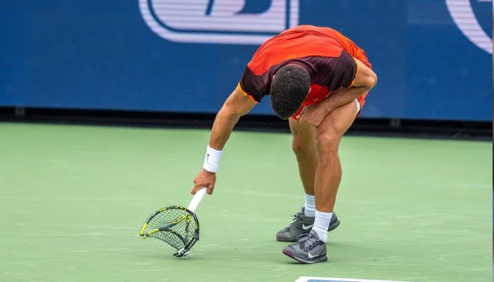 Cincinnati Open: Carlos Alcaraz apologises for smashing racket during surprise defeat